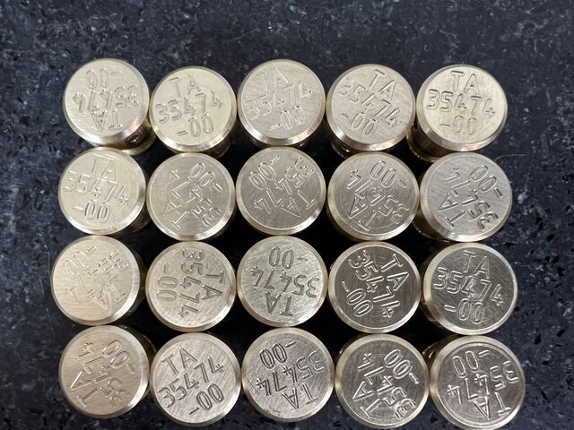 Batch of marked round parts