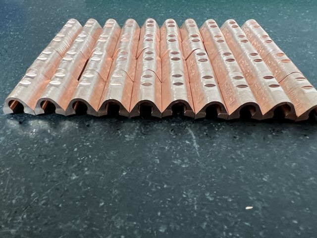 Copper bars with drilled features